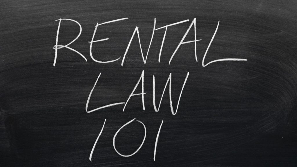 Chalkboard with the phrase 'RENTAL LAW 101' written in large, bold letters, highlighting the introduction of new rental rules in South Australia.